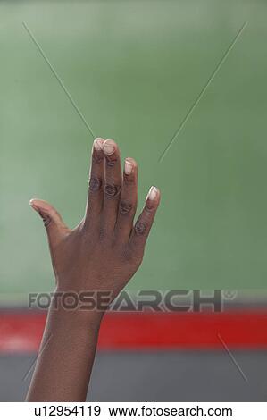 Stock Photo - The pupil hand up. Fotosearch
