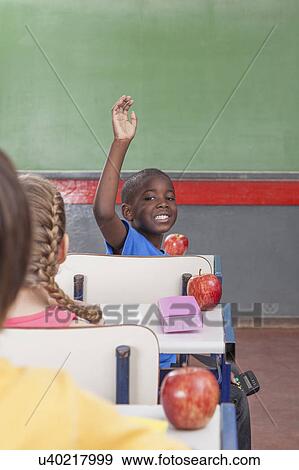 Stock Photo - The pupil hand up. Fotosearch