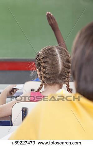 Stock Photo - The pupil hand up. Fotosearch