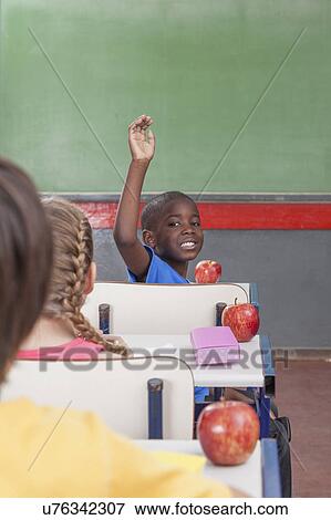 Stock Photo - The pupil hand up. Fotosearch