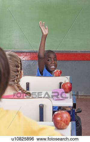 Stock Photograph - The pupil hand up. Fotosearch