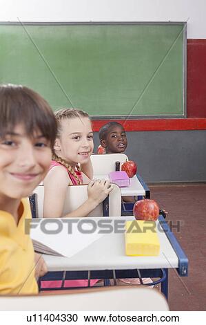 Stock Image - The students looking at back. Fotosearch