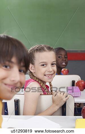 Stock Photo - The students looking at back. Fotosearch