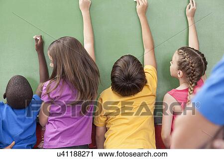The students writing on the blackboard View Large Photo Image Stock Image - The students writing on the blackboard. Fotosearch