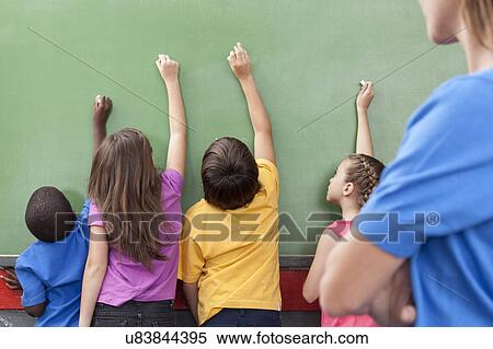 The students writing on the blackboard View Large Photo Image Stock Photography - The students writing on the blackboard. Fotosearch