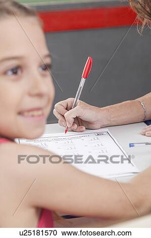 The teacher checking the homework View Large Photo Image Stock Image - The teacher checking the homework. Fotosearch