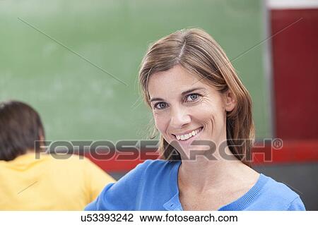 Stock Image - The teacher looking at camera. Fotosearch