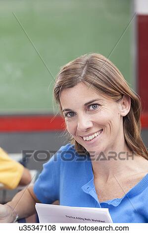 Stock Photo - The teacher looking at camera. Fotosearch