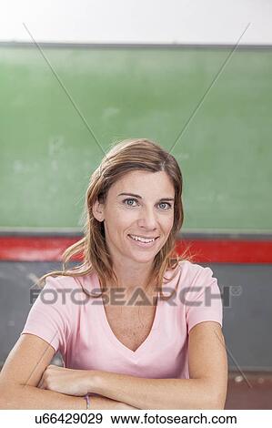 Stock Photo - The teacher looking at camera. Fotosearch