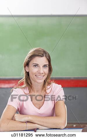 Stock Photography - The teacher looking at camera. Fotosearch