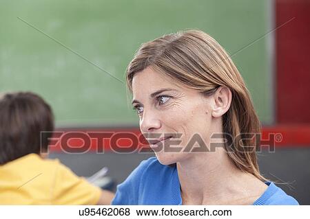 The teacher looking at pupil View Large Photo Image Stock Photo - The teacher looking at pupil. Fotosearch