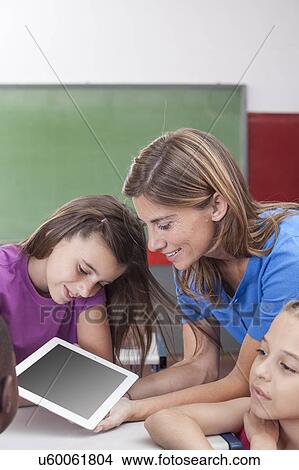The teacher showing something View Large Photo Image Picture - The teacher showing something. Fotosearch