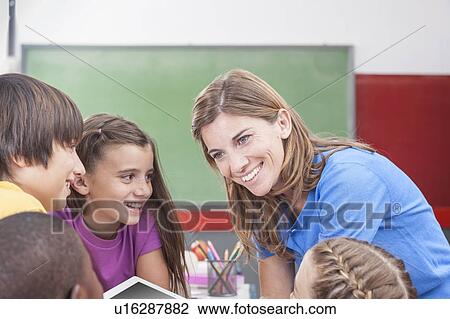 The teacher showing something View Large Photo Image Stock Image - The teacher showing something. Fotosearch