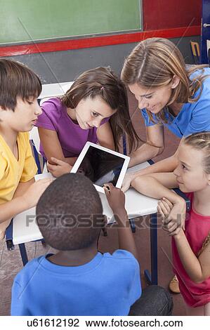 The teacher showing something View Large Photo Image Stock Image - The teacher showing something. Fotosearch