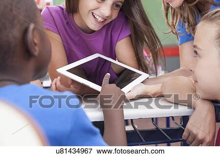 Stock Photo - The teacher showing something. Fotosearch