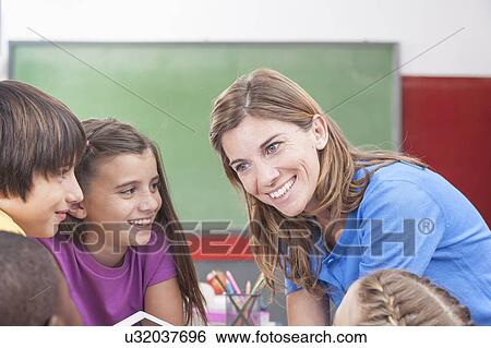 The teacher showing something View Large Photo Image Stock Photograph - The teacher showing something. Fotosearch