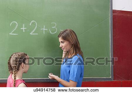 Stock Photo - The teacher teaching math. Fotosearch