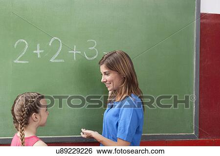 Stock Photograph - The teacher teaching math. Fotosearch