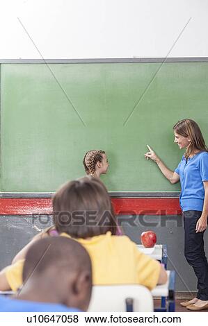 Stock Photo - The teacher teaching. Fotosearch
