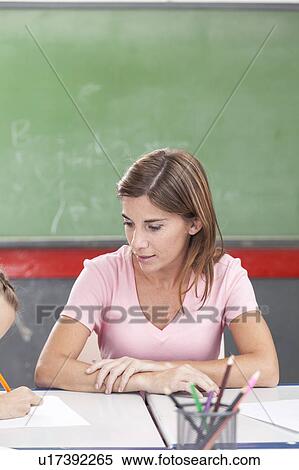 Stock Photography - The teacher teaching. Fotosearch