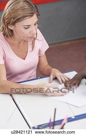 The teacher teaching to draw View Large Photo Image Stock Image - The teacher teaching to draw. Fotosearch