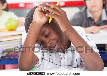 upset boy in the classroom View Large Photo Image Stock Image - upset boy in the classroom. Fotosearch
