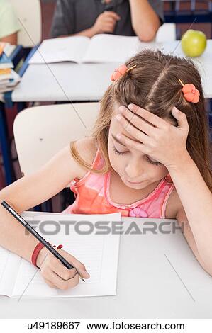 Stock Photo - upset girl writing. Fotosearch
