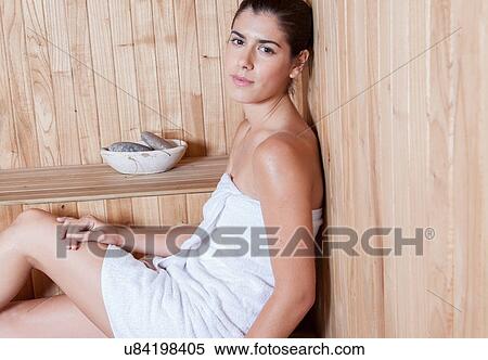 Woman enjoying the sauna View Large Photo Image Stock Photography - Woman enjoying the sauna. Fotosearch