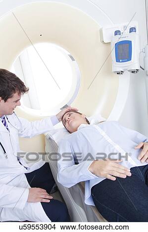 Picture - Woman get a tomography. Fotosearch
