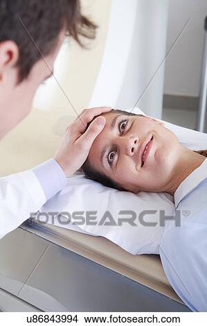 Picture - Woman get a tomography. Fotosearch