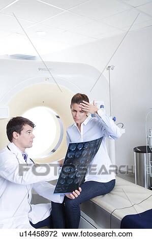 Stock Image - Woman get a tomography. Fotosearch