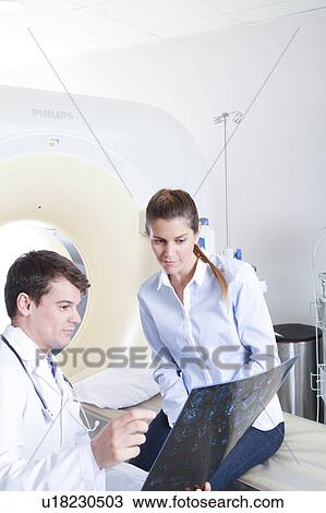 Stock Image - Woman get a tomography. Fotosearch