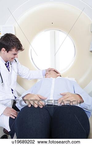 Stock Image - Woman get a tomography. Fotosearch