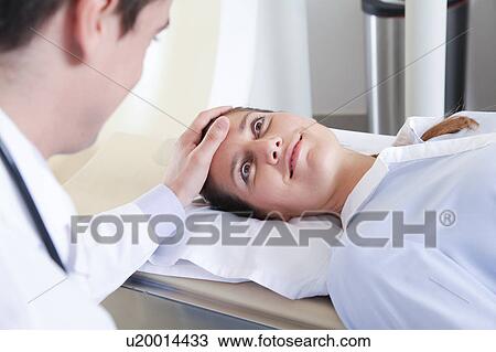 Stock Image - Woman get a tomography. Fotosearch