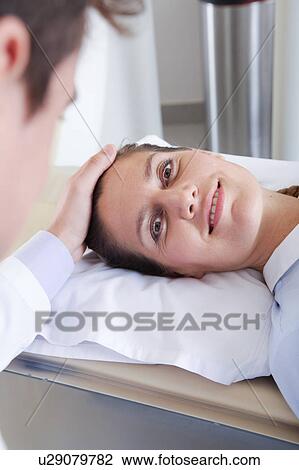 Stock Image - Woman get a tomography. Fotosearch