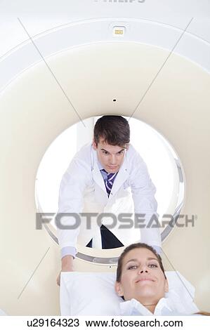 Stock Image - Woman get a tomography. Fotosearch