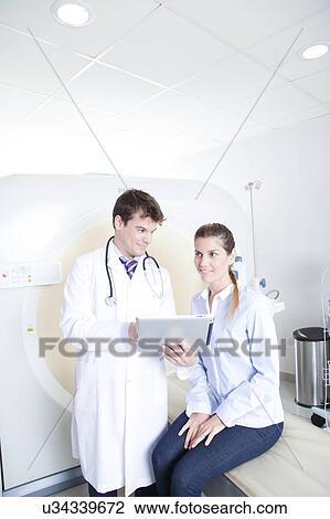 Stock Image - Woman get a tomography. Fotosearch