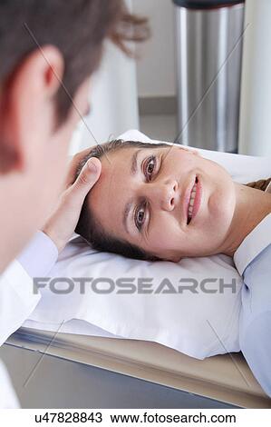 Stock Image - Woman get a tomography. Fotosearch