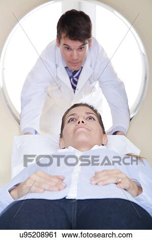 Stock Image - Woman get a tomography. Fotosearch