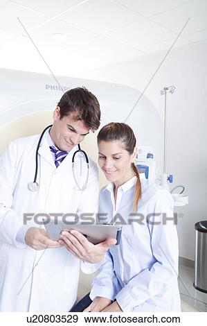Stock Photo - Woman get a tomography. Fotosearch