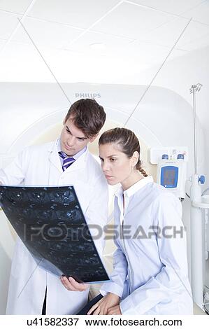Stock Photo - Woman get a tomography. Fotosearch