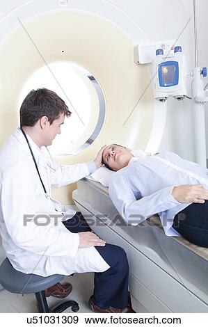 Stock Photo - Woman get a tomography. Fotosearch