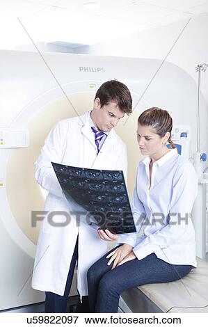 Stock Photo - Woman get a tomography. Fotosearch