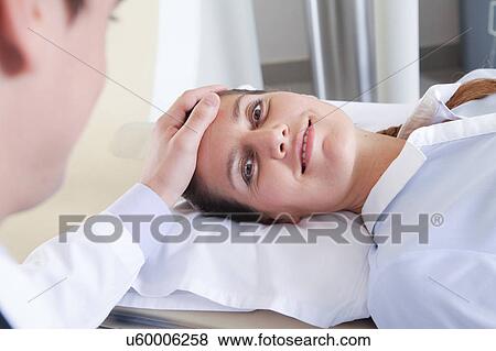 Stock Photo - Woman get a tomography. Fotosearch