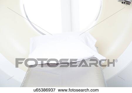 Stock Photo - Woman get a tomography. Fotosearch