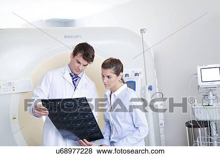 Stock Photo - Woman get a tomography. Fotosearch