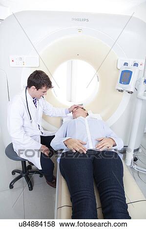 Stock Photo - Woman get a tomography. Fotosearch