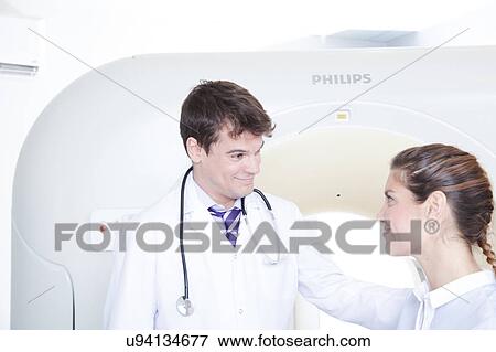 Stock Photo - Woman get a tomography. Fotosearch