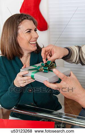 Stock Photo - Woman getting a gift. Fotosearch
