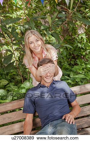 Woman giving to her boyfriend a surprise View Large Photo Image Stock Photo - Woman giving to her boyfriend a surprise. Fotosearch
